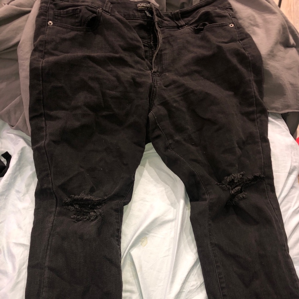 Black ripped knee jeans